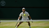 Serbia's Novak Djokovic prepares to return to France's Arthur Rinderknech during their men's singles third round tennis match on the fifth day of the 2026 Wimbledon Championships at The All England Lawn Tennis and Croquet Club in Wimbledon, southwest London, on July 3, 2026. (Photo by Glyn KIRK / AFP) 
 