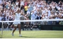 Philippines' Alexandra Eala celebrates beating Poland's Iga Swiatek during their women's singles third round tennis match on the sixth day of the 2026 Wimbledon Championships at The All England Lawn Tennis and Croquet Club in Wimbledon, southwest London, on July 4, 2026. (Photo by Henry NICHOLLS / AFP) / RESTRICTED TO EDITORIAL USE