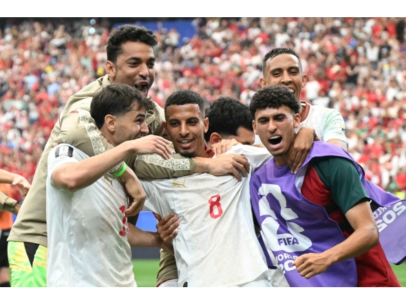 Morocco's midfielder #08 Azzedine Ounahi celebrates scoring his team's second goal with teammates during the 2026 World Cup round of 16 football match between Canada and Morocco at the Houston Stadium in Houston on July 4, 2026. (Photo by RONALDO SCHEMIDT / AFP)