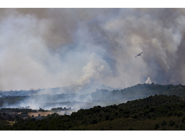 Canadair CL-415 aircraft of France's Civil Security services drop water on a wildfire at the Col des Auzines, near Trevillach, southern France, on July 5, 2026.  (Photo by Matthieu RONDEL / AFP)