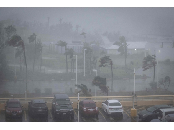 Strong wind brought by Super Typhoon Bavi hits Guam on July 6, 2026. (Photo by Yuichi YAMAZAKI / AFP)
