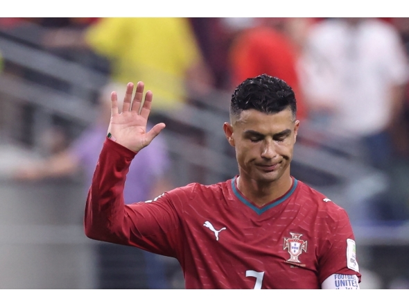 Portugal's forward #07 Cristiano Ronaldo waves to fans after losing the 2026 World Cup round of 16 football match between Portugal and Spain at the Dallas Stadium in Arlington on July 6, 2026. (Photo by Thomas Coex / AFP)