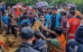 Bangladesh rescue personnel and volunteers work at the site of a landslide triggered by heavy rains at a school in the Kutupalong refugee camp in Cox's Bazar on July 8, 2026. (Photo by AFP)
 