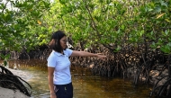 This photo taken on April 16, 2026, shows WWF Philippines Project Manager Andrea Pimentel as she talks about the mangroves in Ticao Island, in the province of Masbate. (Photo by Jam Sta Rosa / AFP) 
