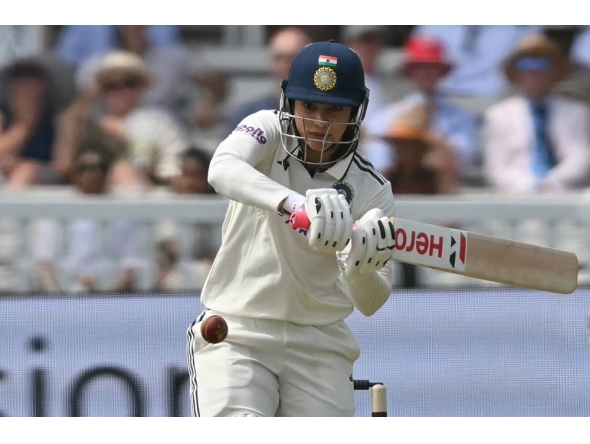 India's Smriti Mandhana hits a boundary on the first day of the first Women's cricket Test match between England and India at Lord's cricket ground in London, on July 10, 2026. (Photo by Justin Tallis / AFP)