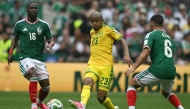 Mexico's forward #16 Julian Quinones, South Africa's midfielder #23 Jayden Adams and Mexico's midfielder #06 Erik Lira during the 2026 World Cup Group A football match between Mexico and South Africa at the Mexico City Stadium in Mexico City on June 11, 2026. Photo by CARL DE SOUZA / AFP