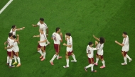Spain’s players celebrate after Mikel Oyarzabal scored his team’s first goal during the semi-final against France on Tuesday. (AFP)