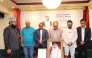 Participants observe a moment of silence during the condolence meeting.
