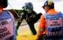 Mercedes' British driver George Russell reacts as he leaves the racing tack after crashing in gravels following a collision with Ferrari's British driver Lewis Hamilton during the first round in the Formula One Belgian Grand Prix at the Spa-Francorchamps circuit, in Spa, on July 19, 2026. (Photo by JOHN THYS / AFP)