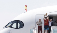Spain’s coach Luis de la Fuente (left) and captain Rodri hold the World Cup trophy upon their arrival in Madrid Barajas’ airport. 