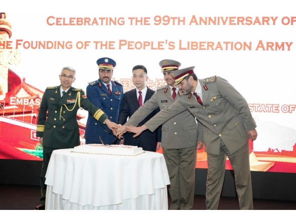 Chinese Ambassador to Qatar H E Cao Xiaolin (centre) and other officials during a cake-cutting ceremony at the reception.