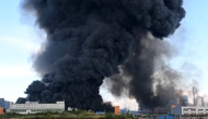 Smoke rises above a warehouse in Saint Petersburg on July 24, 2026, amid the ongoing Russian-Ukrainian conflict. (Photo by AFP)