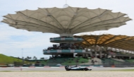 (Files) Then Mercedes's British driver Lewis Hamilton drives his car during the third practice session of the Formula One Malaysia Grand Prix in Sepang on September 30, 2017. (Photo by Manan Vatsyayana / AFP)