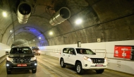 Vehicles ride through the newly inaugurated Nagdhunga tunnel, Nepal's first modern road tunnel, on the outskirts of Kathmandu on July 27, 2026. (Photo by Prakash MATHEMA / AFP)