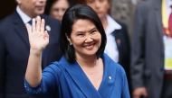 Peru's president-elect Keiko Fujimori waves as she leaves the Foreign Affairs Ministry building for the Congress building after bilateral meetings with heads of state in Lima, on July 28, 2026, ahead of her inauguration. (Photo by Connie FRANCE / AFP)

