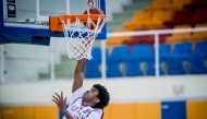 Qatar's Abdullah Yassin goes for a basket