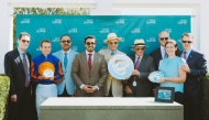 Visit Qatar officials with winners during trophy presenting ceremony.
