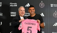 Brazilian midfielder Casemiro poses with Inter Miami managing owner and CEO Jorge Mas, on July 30, 2026. (Photo by Chandan Khanna / AFP)