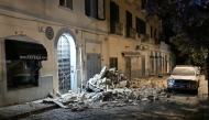This photograph shows a car crushed by rubble after a magnitude 4.7 earthquake struck the Campi Flegrei area in Pozzuoli, near Naples on July 31, 2026. (Photo by Felice DE MARTINO / ANSA / AFP) /
