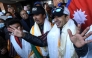 Nepali mountaineer Nirmal Purja (R) talks to the media along with his team at the Tribhuvan International airport after becoming the first to summit Pakistan's K2 mountain in winter, in Kathmandu on January 26, 2021. Photo by PRAKASH MATHEMA / AFP
