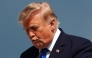 US President Donald Trump gestures while stepping off Air Force One upon arrival at Morristown Municipal Airport in Morristown, New Jersey, on July 31, 2026. (Photo by Aaron Schwartz / AFP)
 