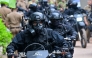 Military personnel wearing anti-riot gear patrol on bikes outside the Mahara Prison complex on the outskirts of Colombo on August 2, 2026. Photo by Ishara S. KODIKARA / AFP