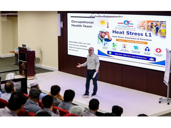 An official speaking during an awareness and training workshop.
