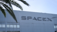 The SpaceX logo is displayed outside a Space Exploration Technologies Corp. facility in Hawthorne, California, on June 8, 2026. Photo by Patrick T. Fallon / AFP