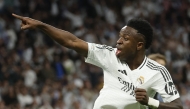 (FILES) Real Madrid's Brazilian forward #07 Vinicius Junior celebrates scoring his team's first goal during the UEFA Champions League quarter final second leg football match between Real Madrid CF and Arsenal at Santiago Bernabeu Stadium in Madrid on April 16, 2025. (Photo by Pierre-Philippe MARCOU / AFP)
