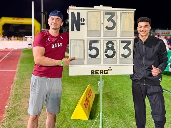 Qatar pole vaulter Saif Mohammed celebrates with his coach after winning the silver medal.