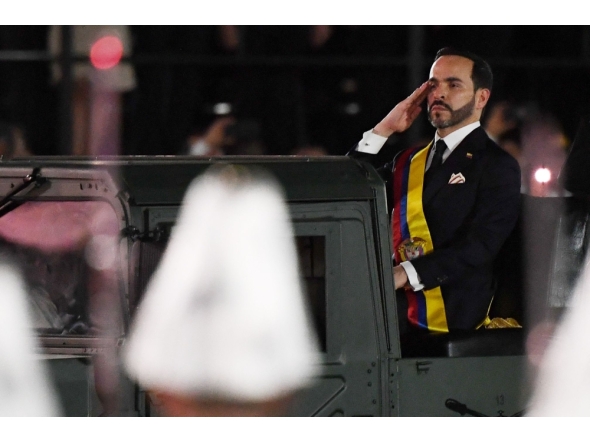 Colombia's new President Abelardo de la Espriella rides in a military vehicle while reviewing troops during a change-of-command ceremony at the Pichincha Battalion following his inauguration in Cali, Colombia, on August 7, 2026. (Photo by Jaime SALDARRIAGA / AFP)