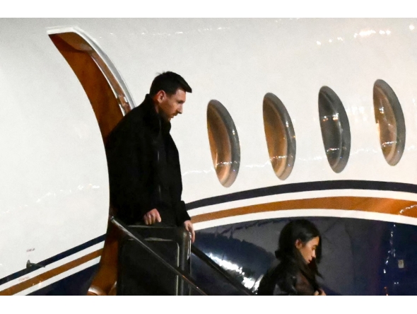 Argentine football star Lionel Messi (L) and his wife Antonela Roccuzzo arrive at the Islas Malvinas International Airport after the death of his father Jorge Messi in Rosario, Santa Fe province, Argentina on August 8, 2026. Photo by LUIS ROBAYO / AFP