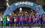 PSG players including Paris Saint-Germain's Brazilian defender #05 Marquinhos celebrate with the trophy after winning the UEFA Supercup football match between Champions League winners Paris Saint Germain (PSG) and Europa League winners Aston Villa in Salzburg, Austria on August 12, 2026. (Photo by FRANCK FIFE / AFP)