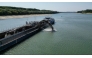An aerial view shows a dredger deployed to deepen the navigable channel due to the low level of Danube near Capidava village, on August 12, 2026.(Photo by Daniel MIHAILESCU / AFP) 