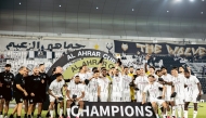 Al Sadd players and officials celebrate after winning Al Ahrar Cup.