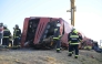 Rescue workers and other officials work at the wreckage of an overturned Polish tourist bus on the M3 motorway near Mezokeresztes, about 150 km east of the Hungarian capital Budapest, on August 16, 2026. Photo by Zoltan MATHE / MTI / AFP