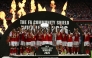 Arsenal's Norwegian midfielder #08 Martin Odegaard lifts the trophy as Arsenal's players celebrate their victory after the English FA Community Shield football match between Arsenal and Manchester City at The Principality Stadium, in Cardiff, south Wales on August 16, 2026. Arsenal won the game 3-0. (Photo by Glyn KIRK / AFP)