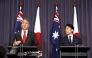 Japan's Defence Minister Shinjiro Koizumi (R) stands with Australian Deputy Prime Minister and Defence Minister Richard Marles (L) during a press conference at Parliament House in Canberra on August 18, 2026. (Photo by HILARY WARDAUGH / AFP)