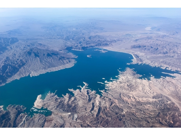 This aerial photo taken on August 6, 2026, shows low water levels in Lake Mead in Nevada. In mid-July, the combined water levels of Lake Powell and Lake Mead, the two largest reservoirs in the United States and both fed by the Colorado River, reached their lowest levels in over 60 years. The Colorado River provides drinking water for more than 40 million people and fuels hydropower across seven states. (Photo by Eva Claire HAMBACH / AFP)