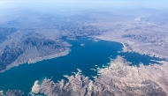 This aerial photo taken on August 6, 2026, shows low water levels in Lake Mead in Nevada. In mid-July, the combined water levels of Lake Powell and Lake Mead, the two largest reservoirs in the United States and both fed by the Colorado River, reached their lowest levels in over 60 years. The Colorado River provides drinking water for more than 40 million people and fuels hydropower across seven states. (Photo by Eva Claire HAMBACH / AFP)