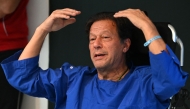 In this picture taken on November 4, 2022, Pakistan's former prime minister Imran Khan addresses the media representatives at a hospital in Lahore. Photo by Arif ALI / AFP