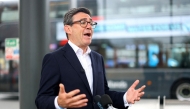 Britain's Prime Minister Andy Burnham speaks to the media, during his visit to Wolverhampton Bus Station, in Wolverhampton, central England on August 18, 2026. (Photo by Hannah McKay / AFP)