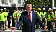 US President Donald Trump speaks to the press at the construction site of a helipad on the South Lawn of the White House in Washington, DC, on August 19, 2026. (Photo by Jim WATSON / AFP)