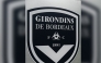 (FILES) This general view taken on May 19, 2022, shows a sign with a logo in front of the chateau of FC Girondins de Bordeaux at the club's training ground in Le Haillan, near Bordeaux, south-western France. (Photo by Philippe LOPEZ / AFP)
