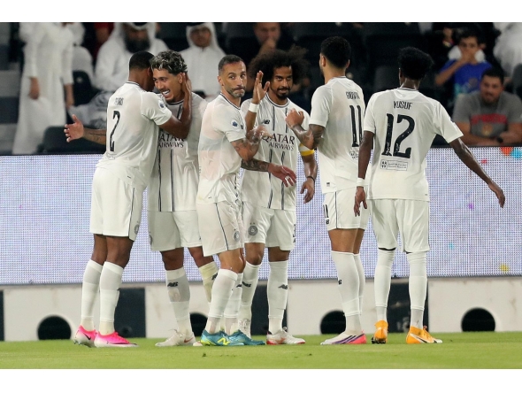 Al Sadd players celebrate during their match against Al Ahli.