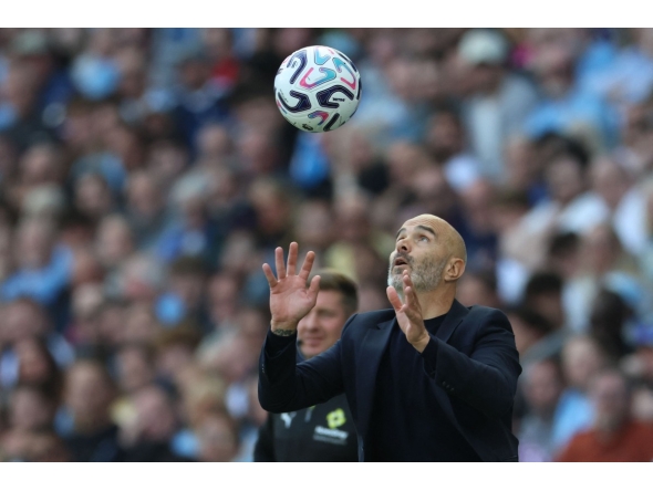 Manchester City's Italian manager Enzo Maresca catches the ball during the English Premier League football match between Manchester City and AFC Bournemouth at the Etihad Stadium in Manchester, north west England, on August 23, 2026. (Photo by Darren Staples / AFP) 
