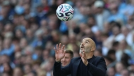 Manchester City's Italian manager Enzo Maresca catches the ball during the English Premier League football match between Manchester City and AFC Bournemouth at the Etihad Stadium in Manchester, north west England, on August 23, 2026. (Photo by Darren Staples / AFP) 
