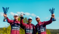 Team Qatar’s Abdulla Ali Al-Khelaifi (centre) poses with the trophy alongside his teammates.
