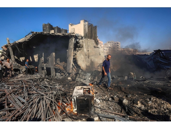 Palestinians inspect the damage at the site of an Israeli airstrike in Gaza City on August 24, 2026. (Photo by Omar AL-QATTAA / AFP)