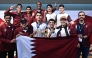 Qatar's players and officials pose for a group photo. 